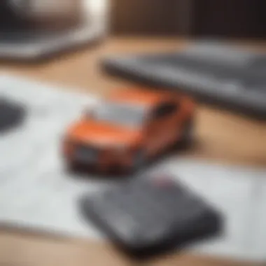 Calculator and a car model on a desk